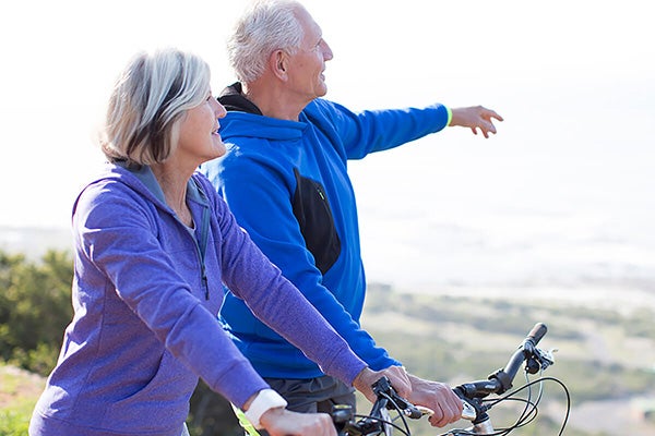 Couple riding their bikes.