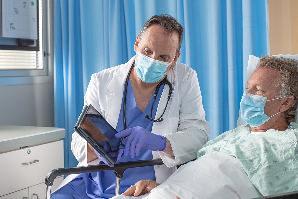 Emergency care doctor talking to a patient.