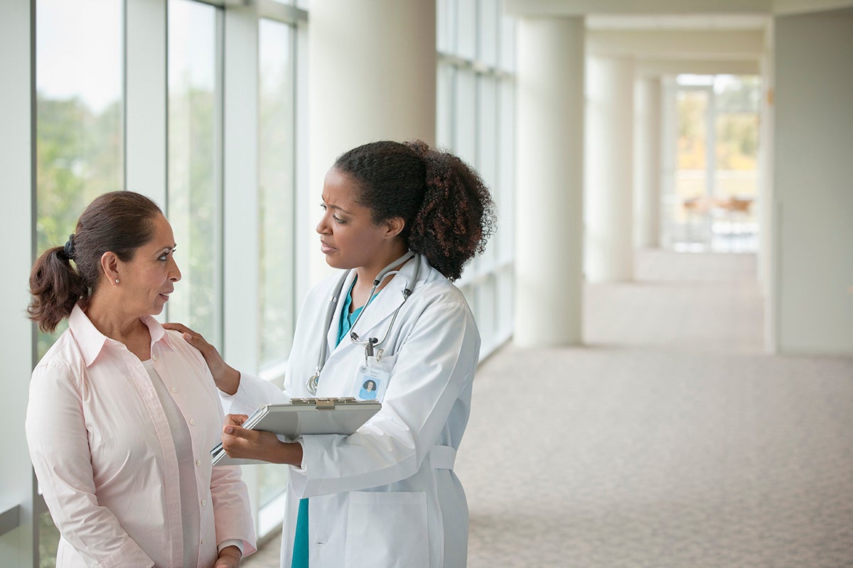 Woman talking to an ob-gyn.