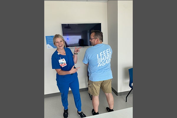 Tad Morgan and Charge Nurse Briley Sutton celebrating Tad's recovery. 