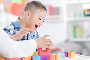 Boy playing with blocks.