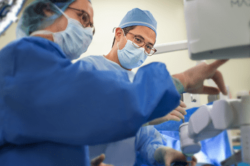 Male surgeon.