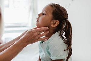 ENT doctor examining a child.